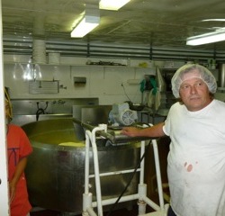 The guy who makes and cuts the cheese